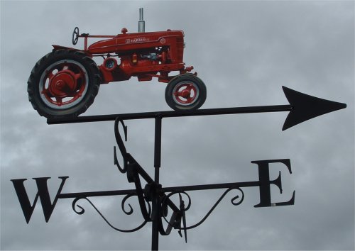 Farmall tractor weathervane painted red with red wheels