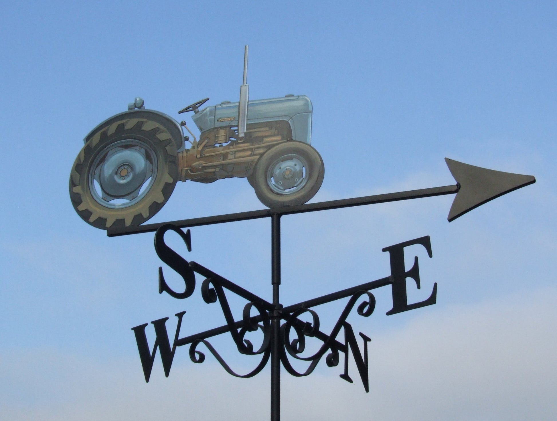 Goldilocks tractor painted blue as a weather vane