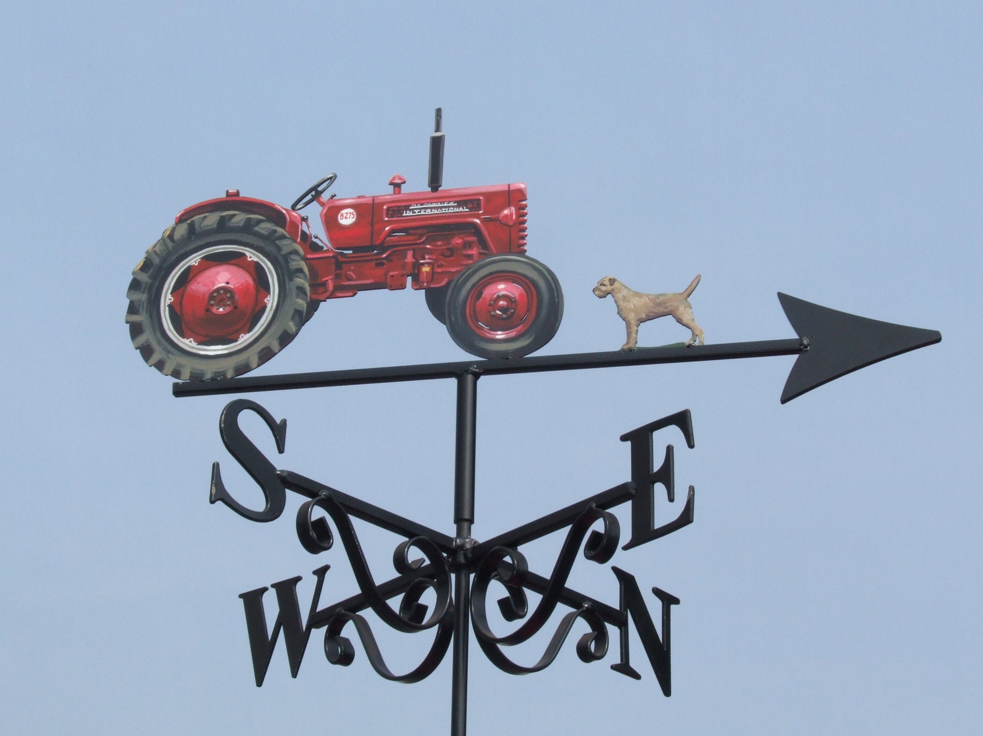 B275 international tractor weathervane depicted with a dog